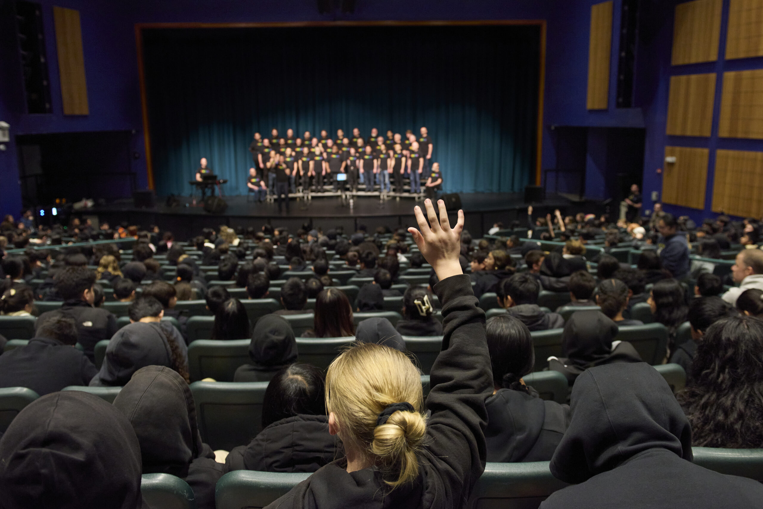 The RHYTHM ensemble performing together on the Bayside Academy stage.