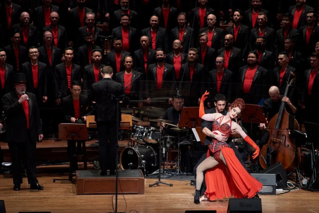 Dancers perform in front of the San Francisco Gay Men’s Chorus and orchestra during Drag Me to the Movies at Davies Symphony Hall.