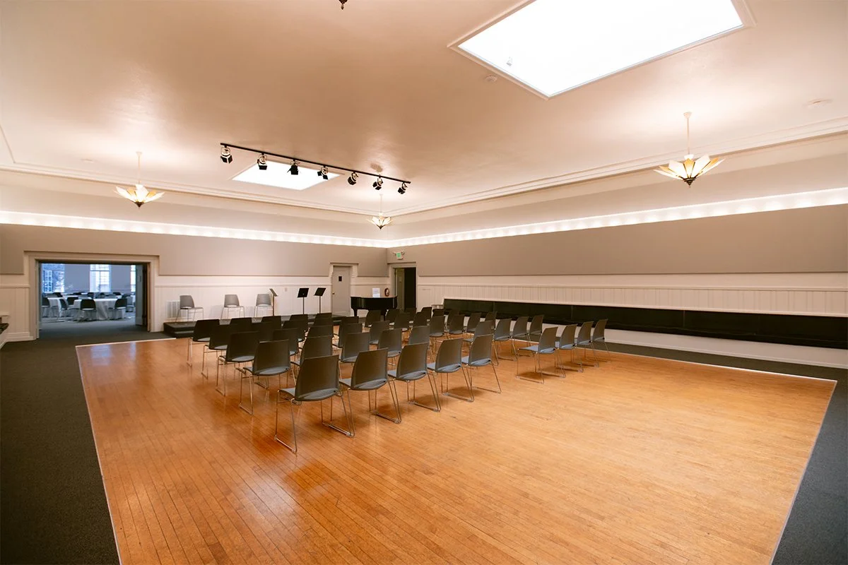 Valencia Room with skylights, wood flooring, a piano and rehearsal seating