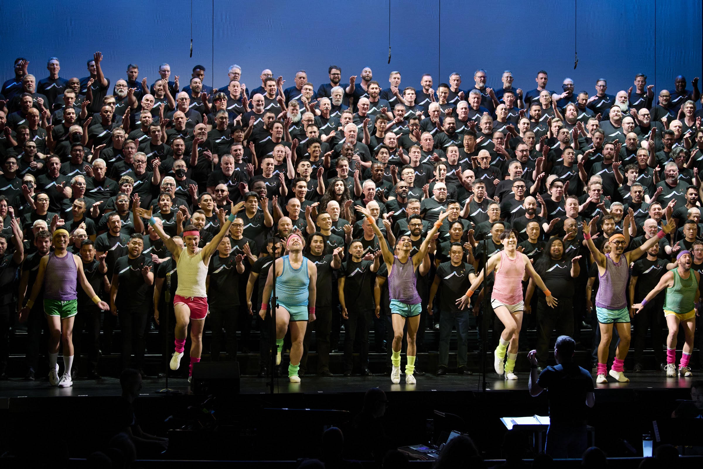 The San Francisco Gay Men’s Chorus performing Totally ’80s! at the Curran Theatre, conducted by Jacob Stensberg