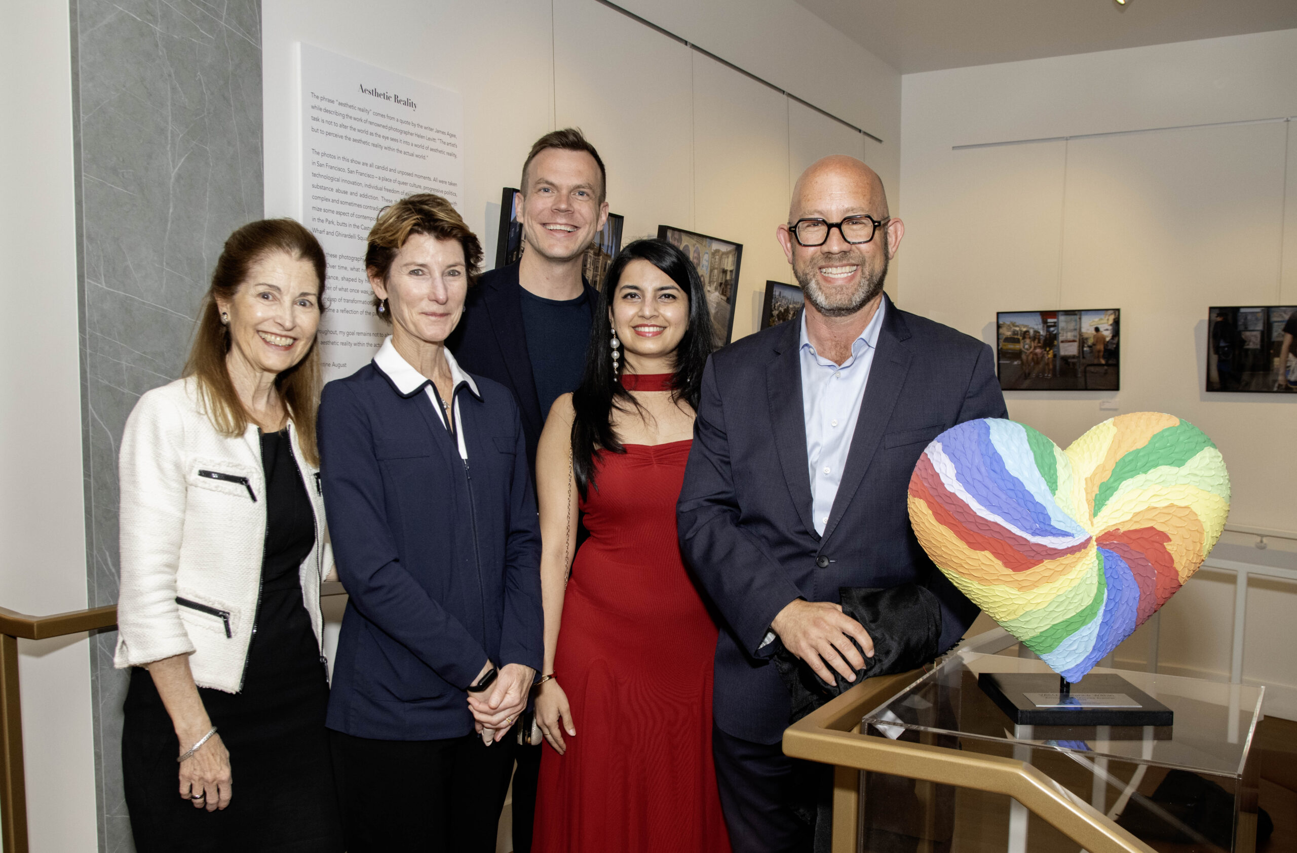 Guests gathered beside Amaura Arts’ colorful VASU: Vibrance Within heart sculpture at The Chan.